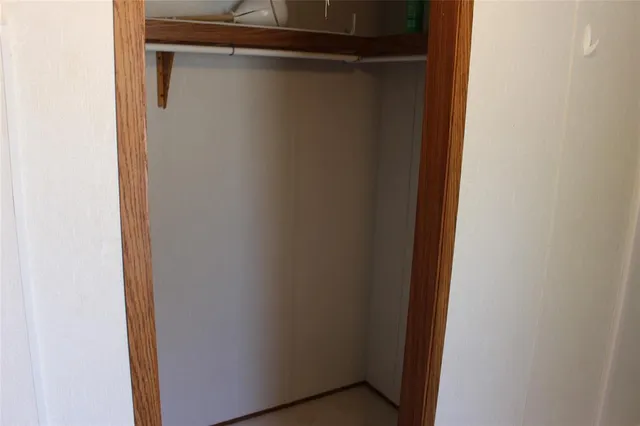 a room with a window and a fan