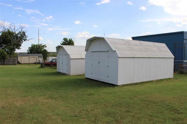 a view of room with wooden floor