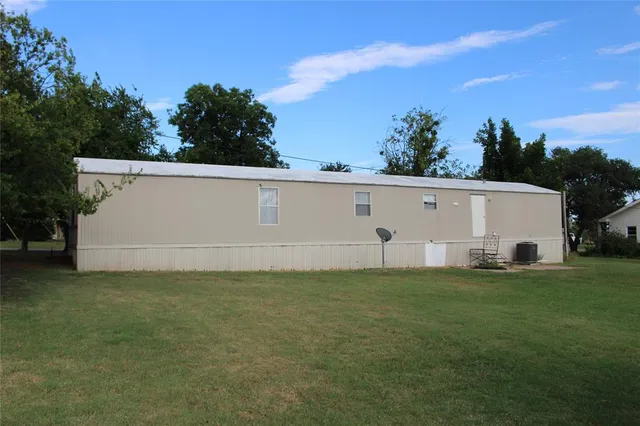 a view of a back yard of the house