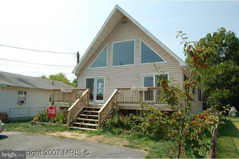 324 St Georges Road Baltimore, MD 21221 - Photo 1 of 15 a view of a house with a yard