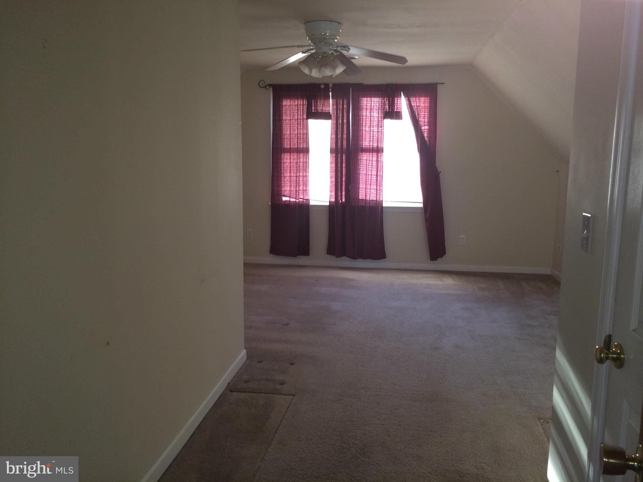 324 St Georges Road Baltimore, MD 21221 - Photo 11 of 15 an empty room with windows
