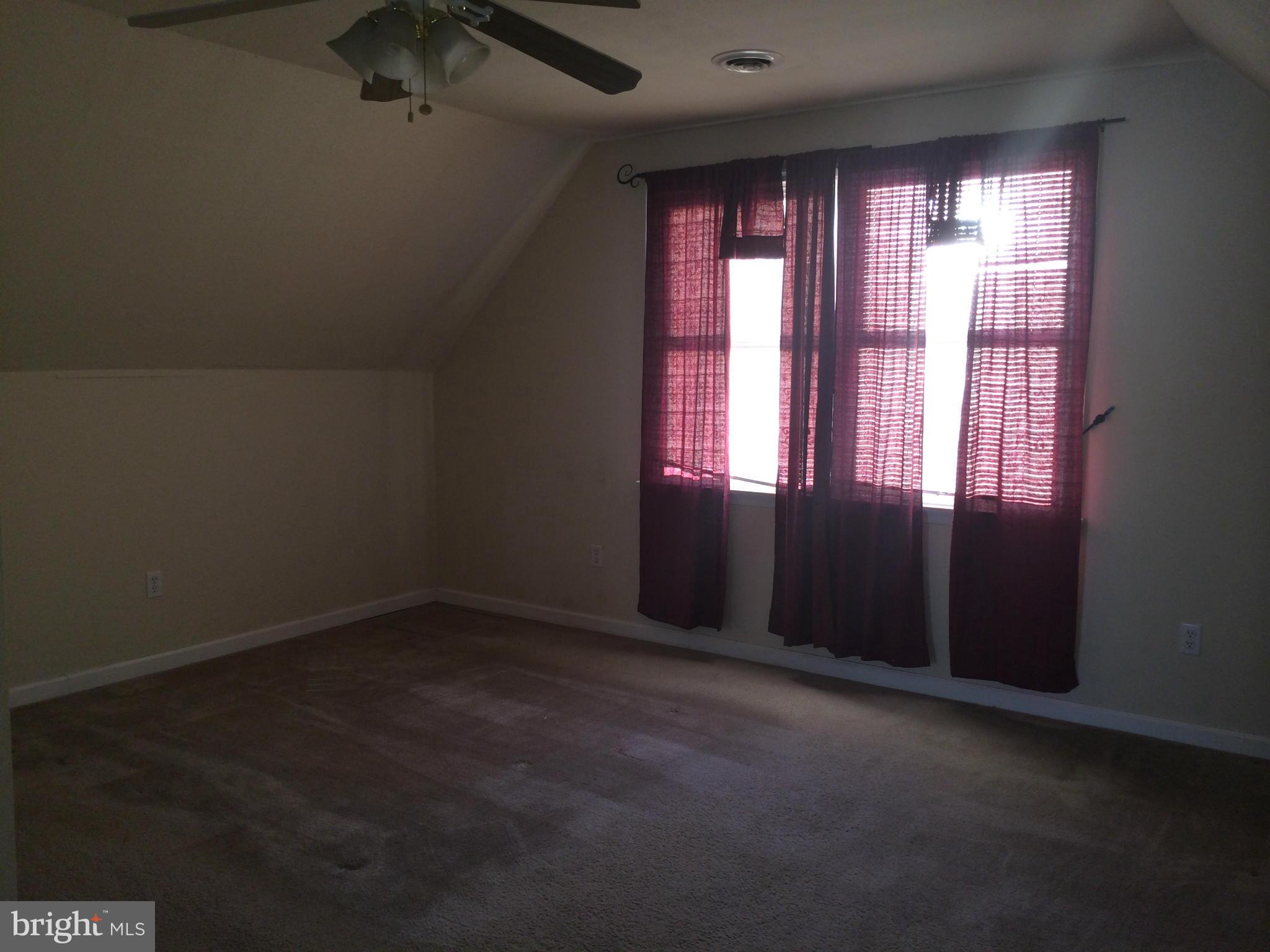 324 St Georges Road Baltimore, MD 21221 - Photo 12 of 15 an empty room with a window
