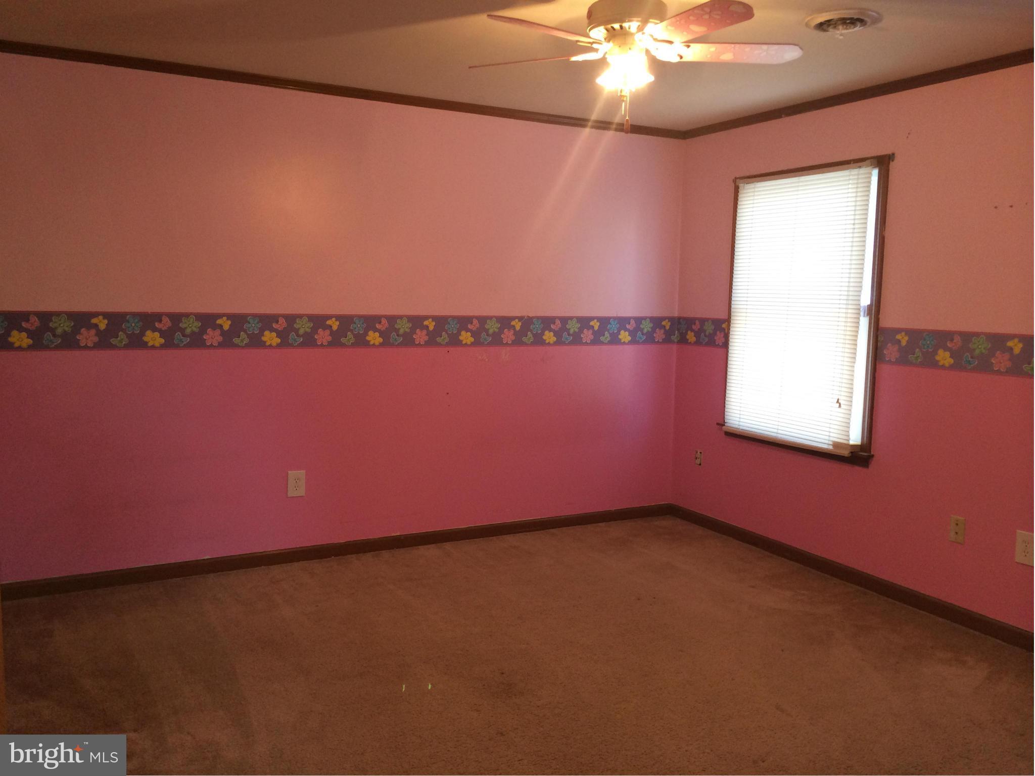 324 St Georges Road Baltimore, MD 21221 - Photo 15 of 15 a view of a room with window and chandelier fan