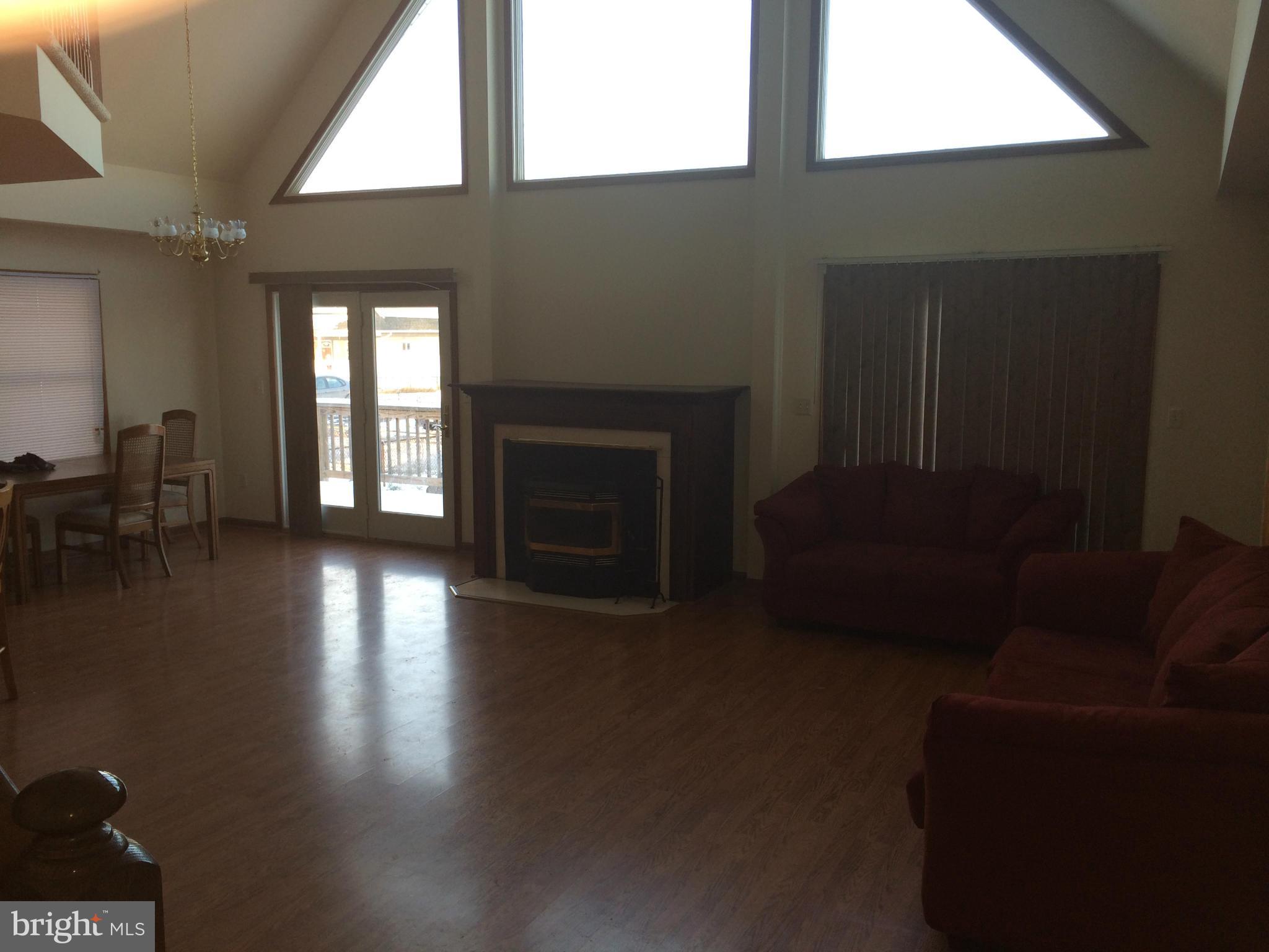 324 St Georges Road Baltimore, MD 21221 - Photo 7 of 15 a living room with furniture window and a fireplace