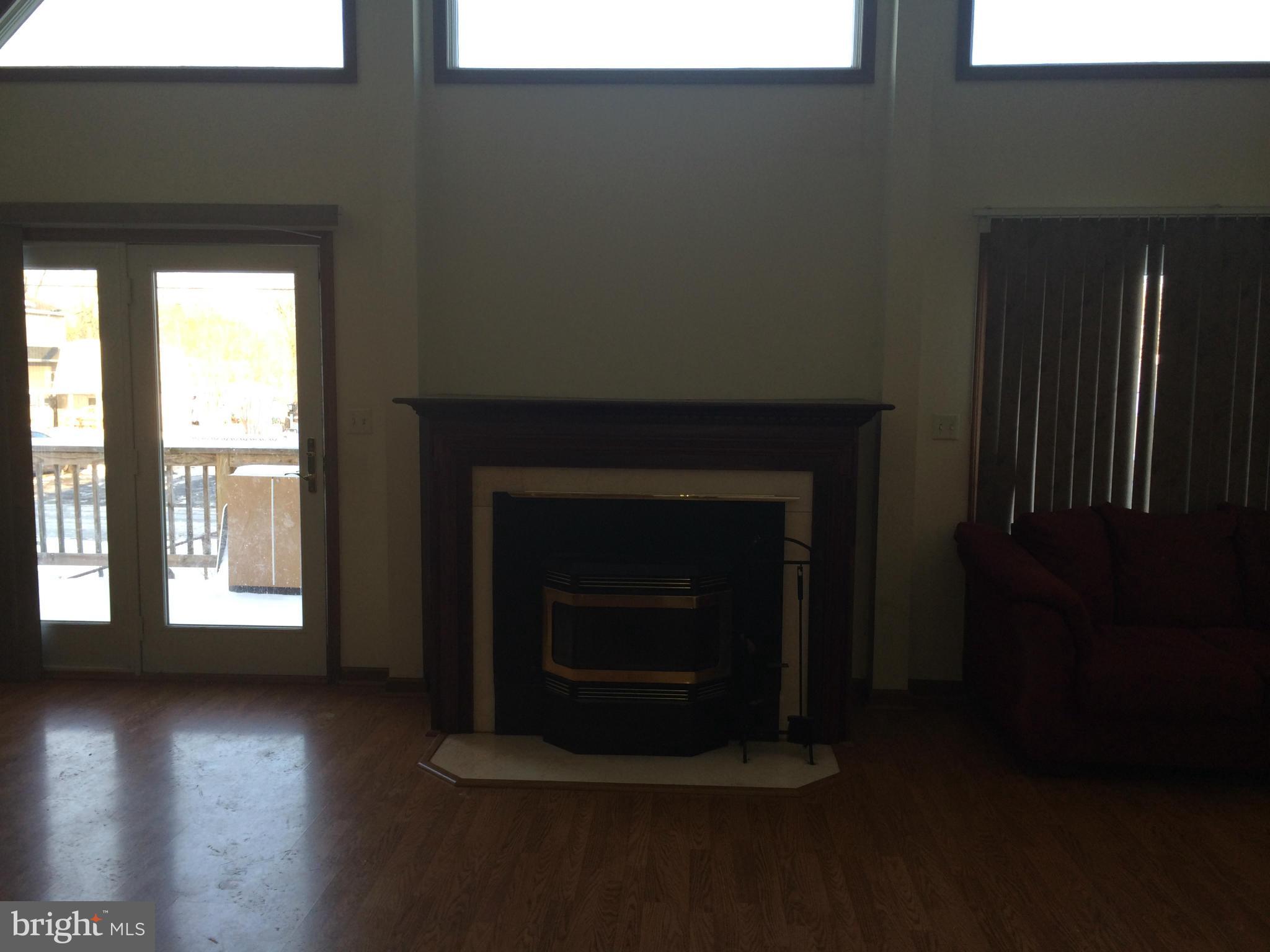 324 St Georges Road Baltimore, MD 21221 - Photo 8 of 15 a living room with a fireplace