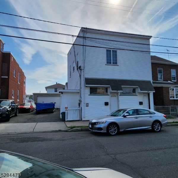 333 Clinton Street Haledon, NJ 07508 - Photo 1 of 13 a car parked in front of a building