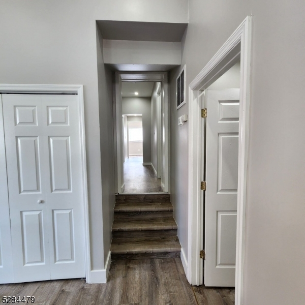 333 Clinton Street Haledon, NJ 07508 - Photo 12 of 13 a view of a hallway with wooden floor and entryway