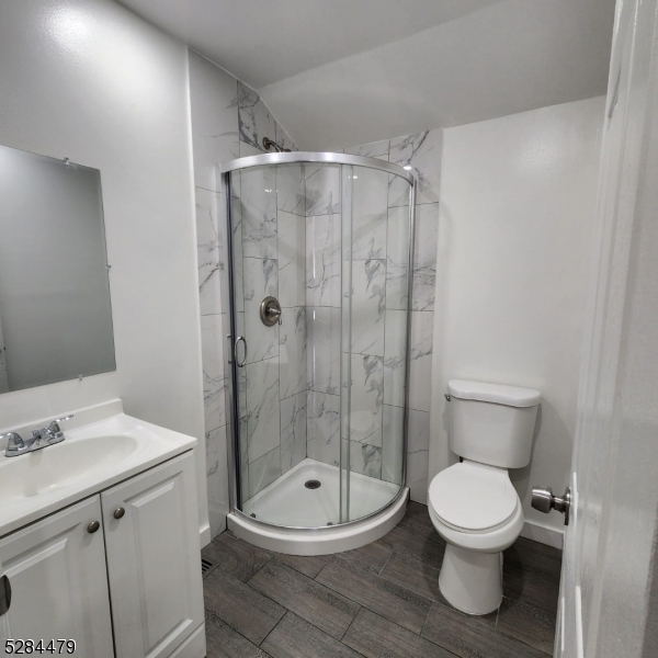 333 Clinton Street Haledon, NJ 07508 - Photo 9 of 13 a bathroom with a toilet a sink and shower