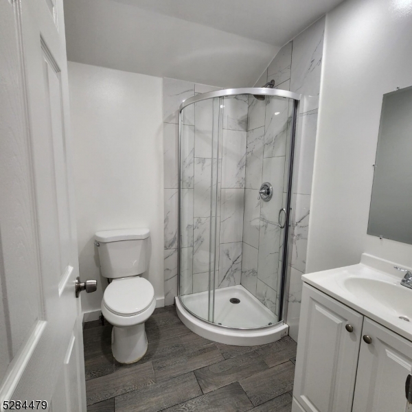 333 Clinton Street Haledon, NJ 07508 - Photo 10 of 13 a bathroom with a toilet and a shower