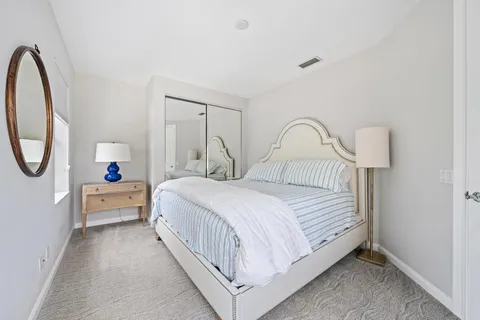 a bedroom with bed and a window