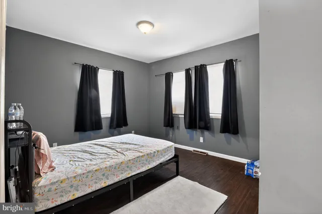 a bathroom with a sink and a shower curtain