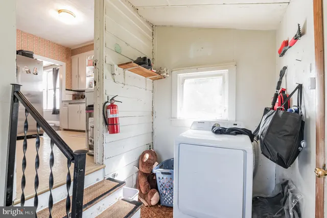 a bedroom with furniture and a mirror