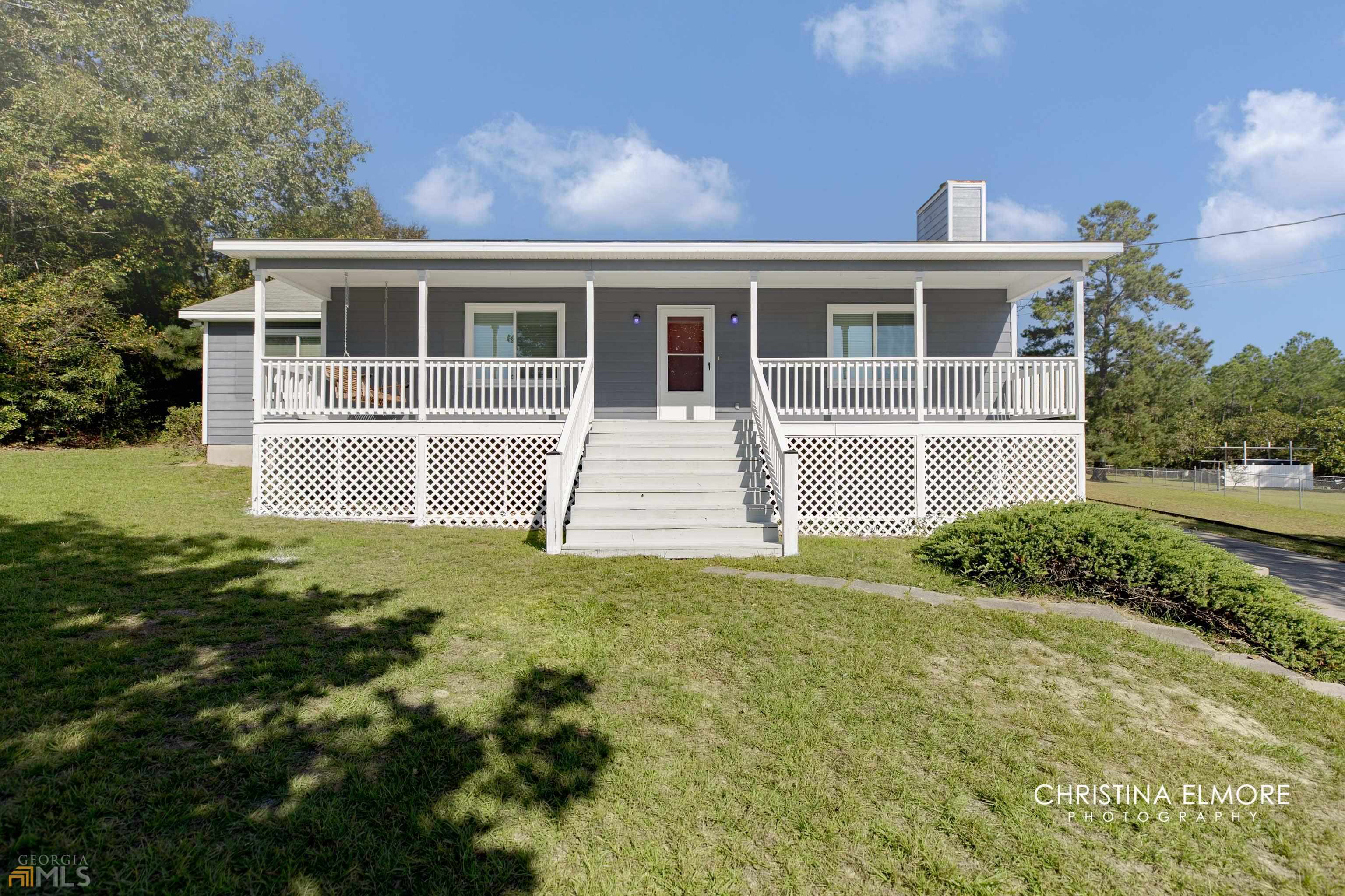 6123 Clayts Circle Macon, GA 31216 - Photo 1 of 1 a front view of a house with a yard