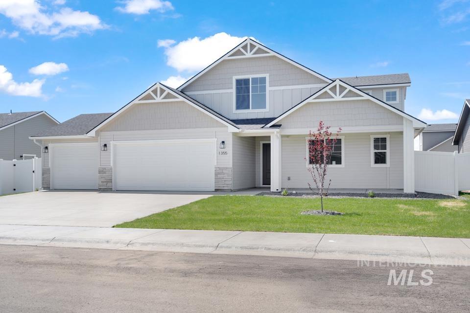 1355 Crescent Street Weiser, ID 83672 - Photo 1 of 31 Craftsman inspired home with an attached garage, driveway, and stone siding