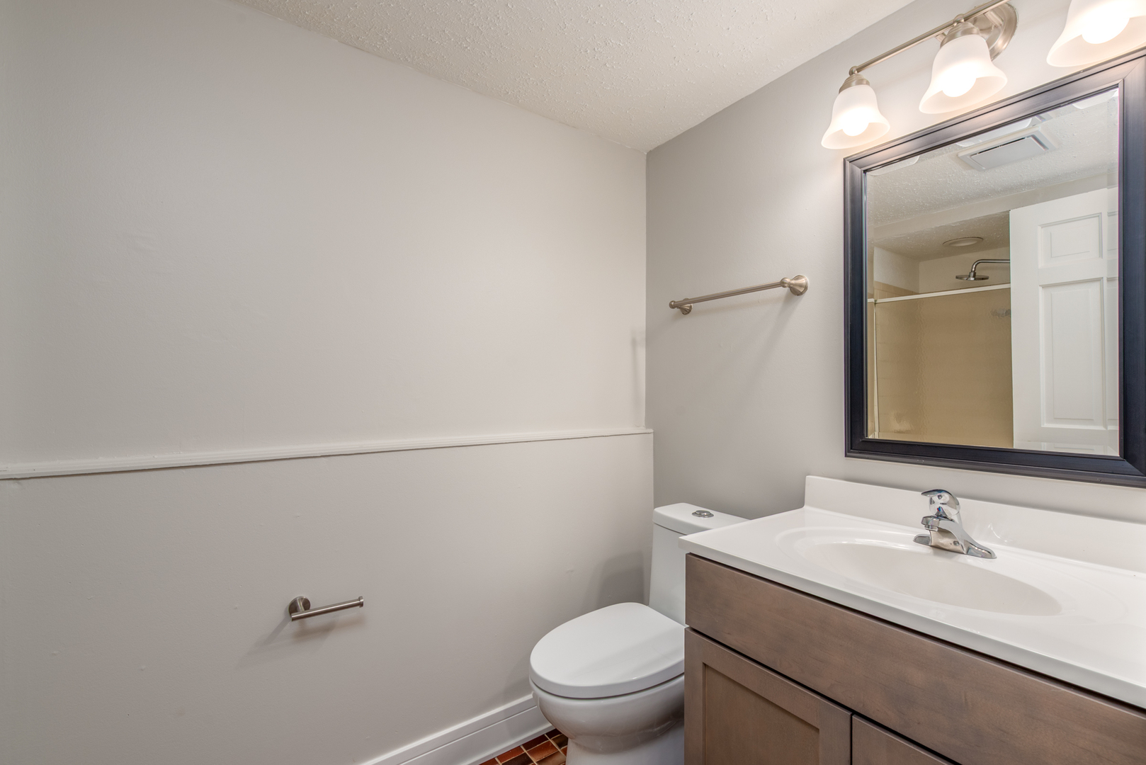 730 Circle Drive Roselle, IL 60172 - Photo 26 of 35 a bathroom with a granite countertop sink toilet and a mirror