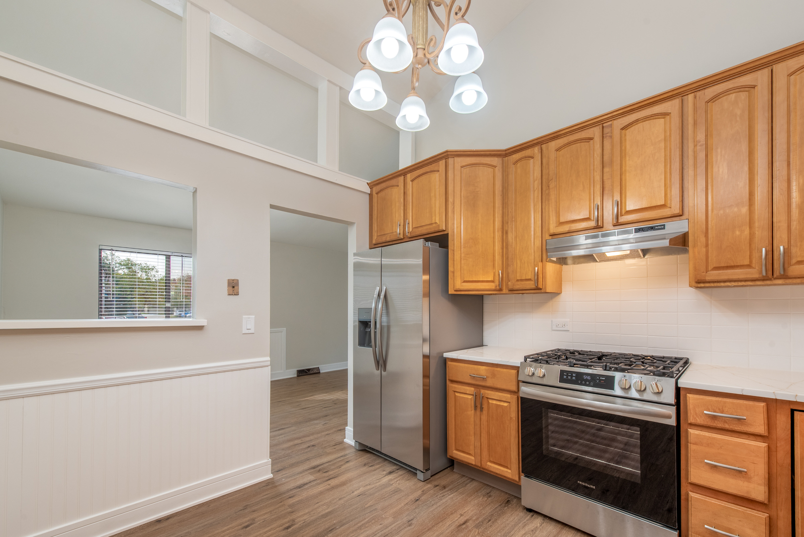 730 Circle Drive Roselle, IL 60172 - Photo 8 of 35 a kitchen with stainless steel appliances granite countertop a stove and a refrigerator
