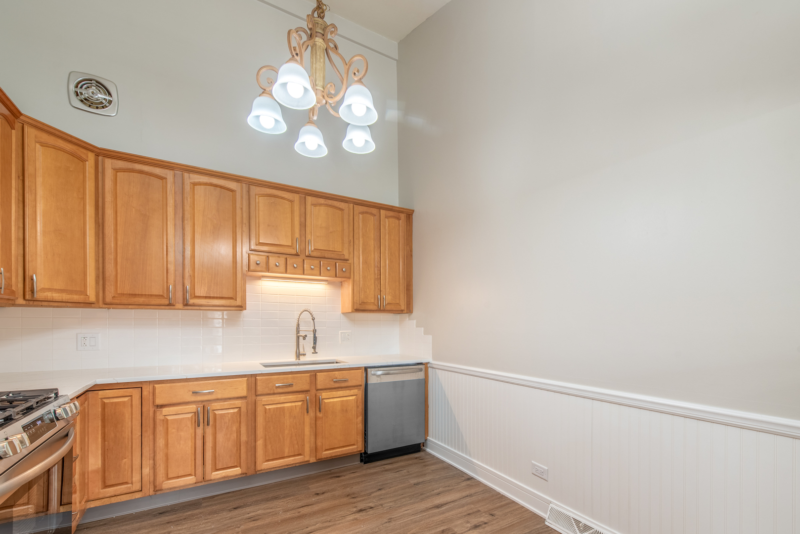 730 Circle Drive Roselle, IL 60172 - Photo 9 of 35 a kitchen with a sink cabinets and wooden floor