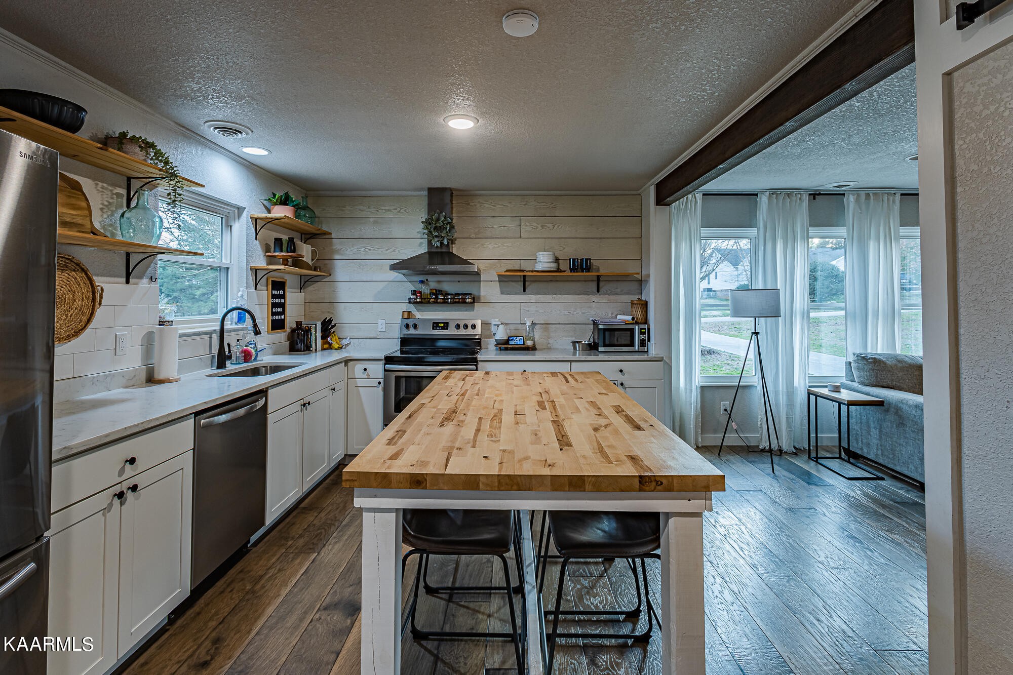 112 County Road 142 Riceville, TN 37370 - Photo 14 of 28 a kitchen with a table chairs refrigerator and cabinets