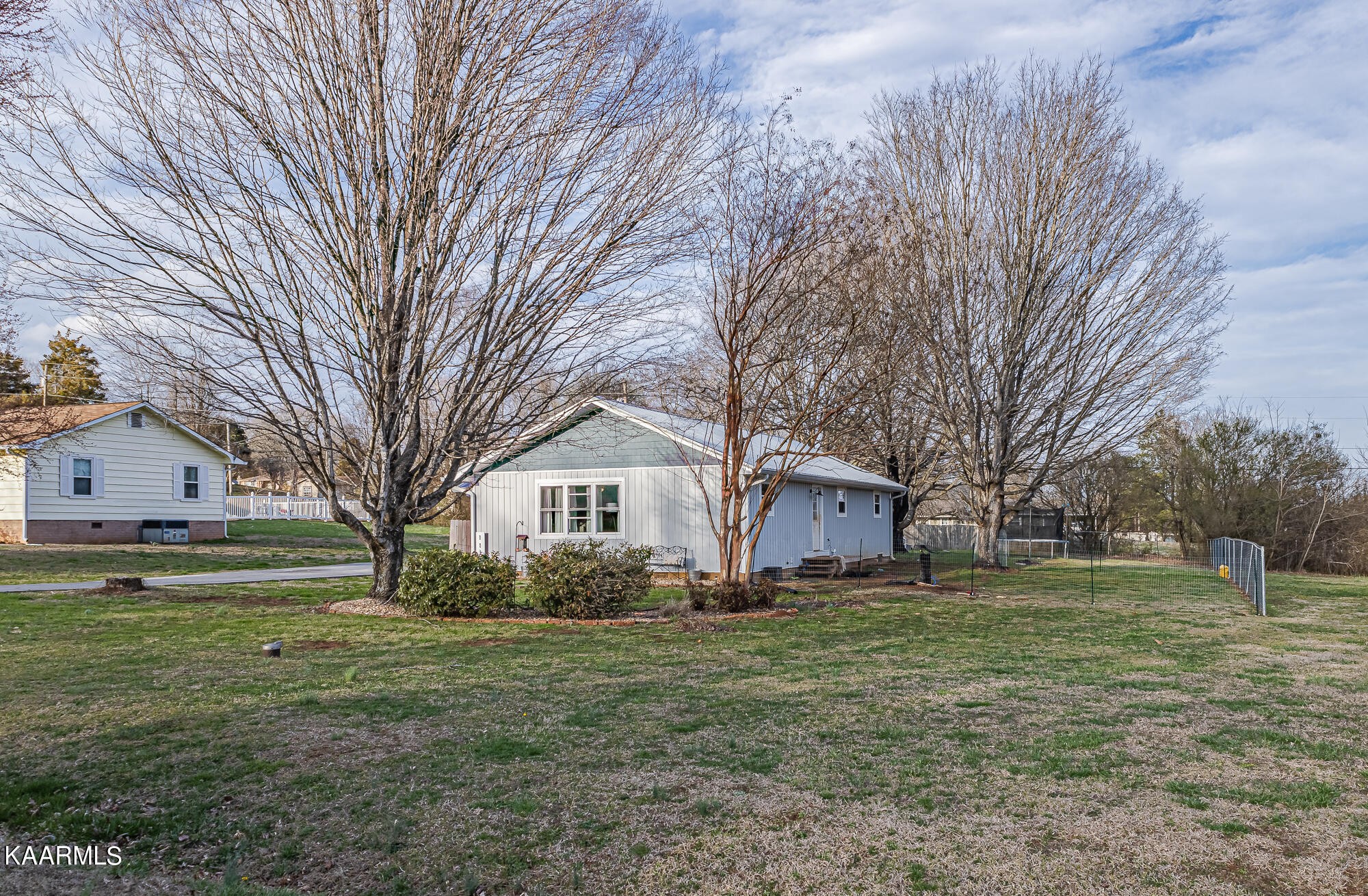 112 County Road 142 Riceville, TN 37370 - Photo 2 of 28 a front view of a house with a yard