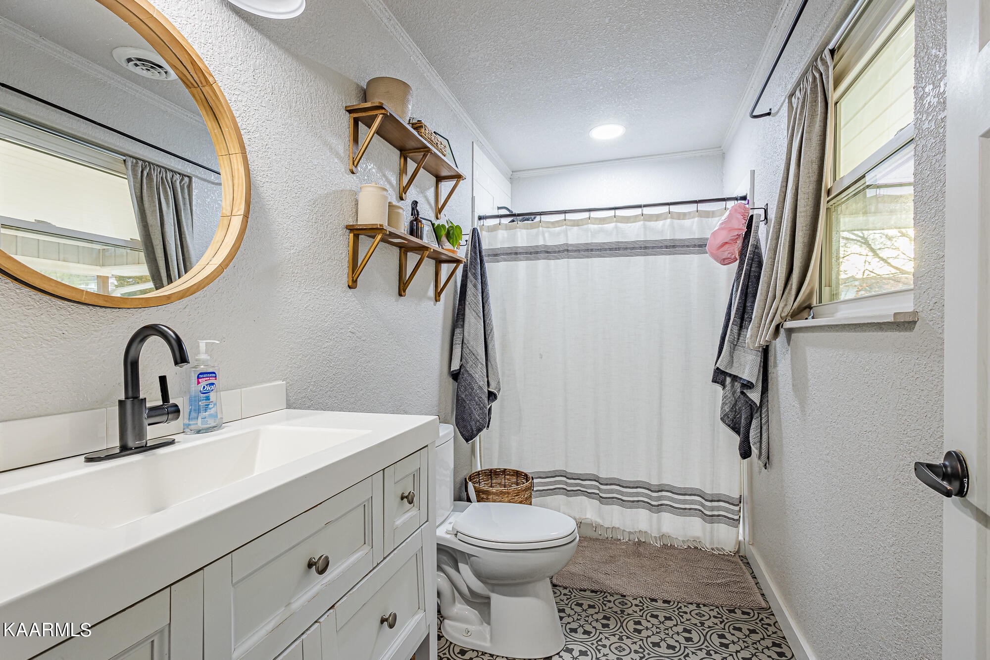 112 County Road 142 Riceville, TN 37370 - Photo 25 of 28 a bathroom with a sink a toilet and a mirror