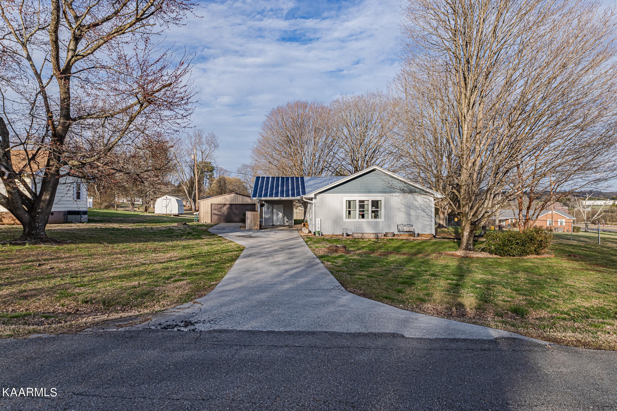 112 County Road 142 Riceville, TN 37370 - Photo 28 of 28 a front view of a house with a yard and garage