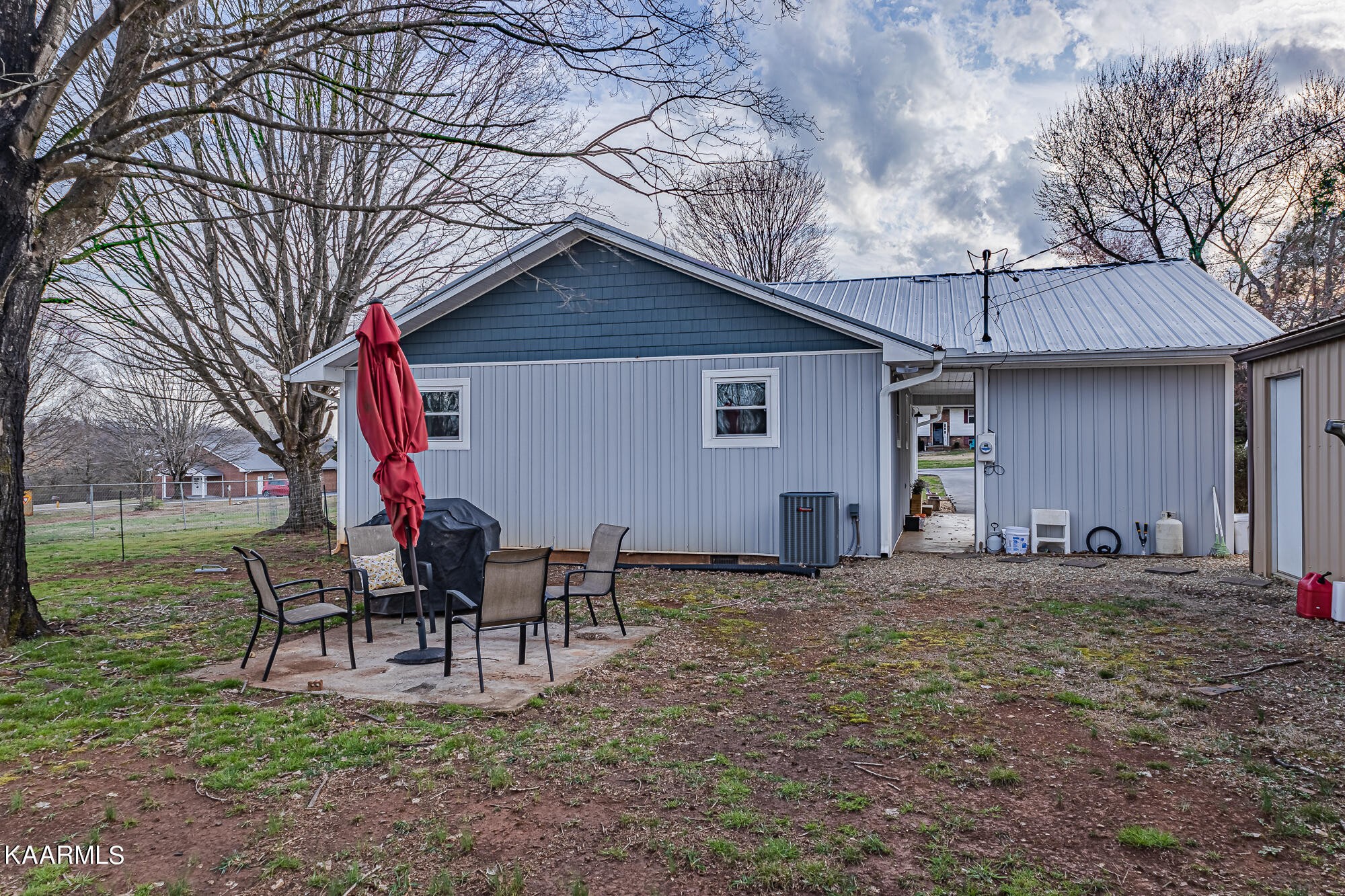 112 County Road 142 Riceville, TN 37370 - Photo 4 of 28 a house view with a sitting space and garden