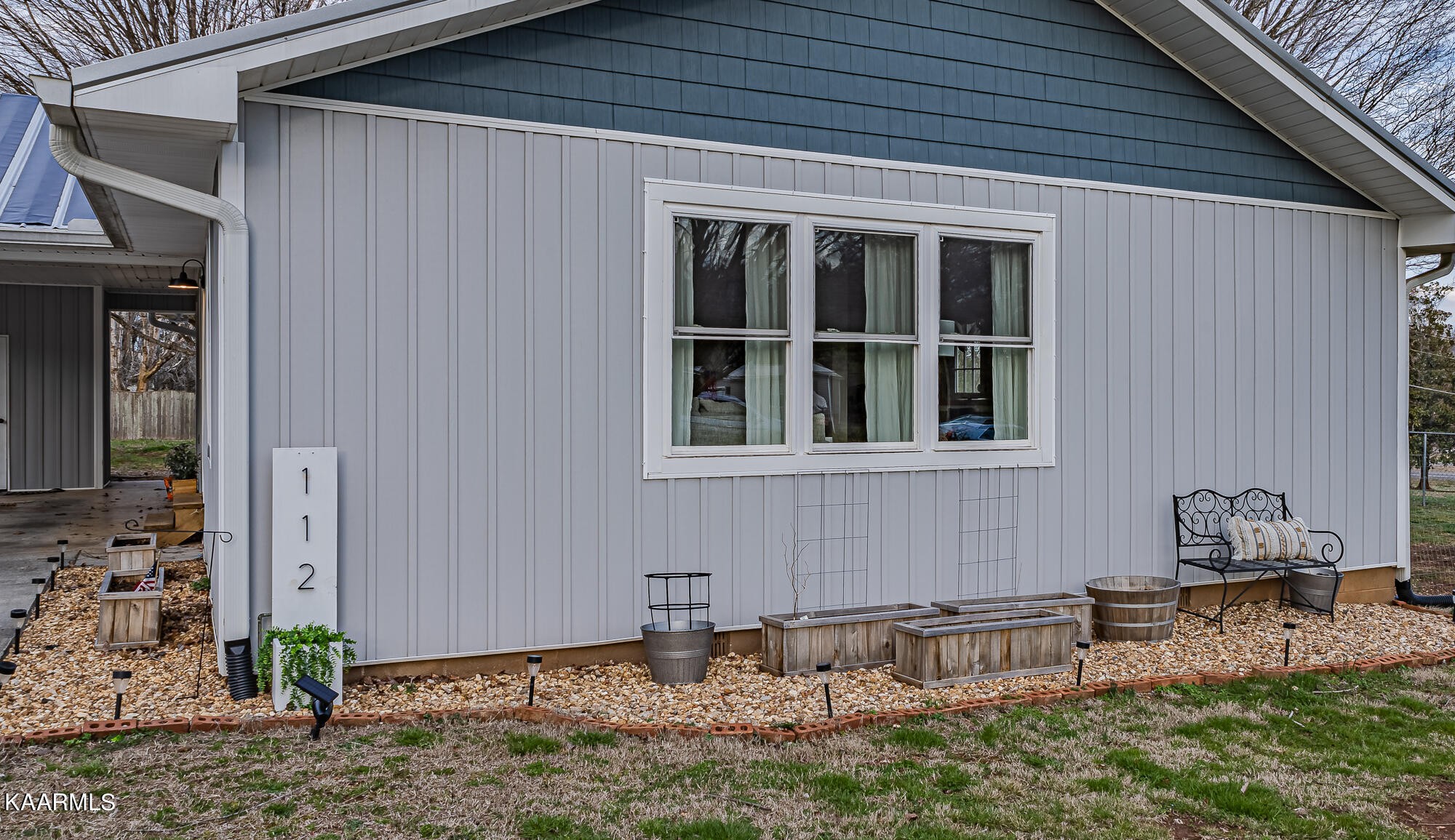 112 County Road 142 Riceville, TN 37370 - Photo 5 of 28 a backyard of a house with table and chairs