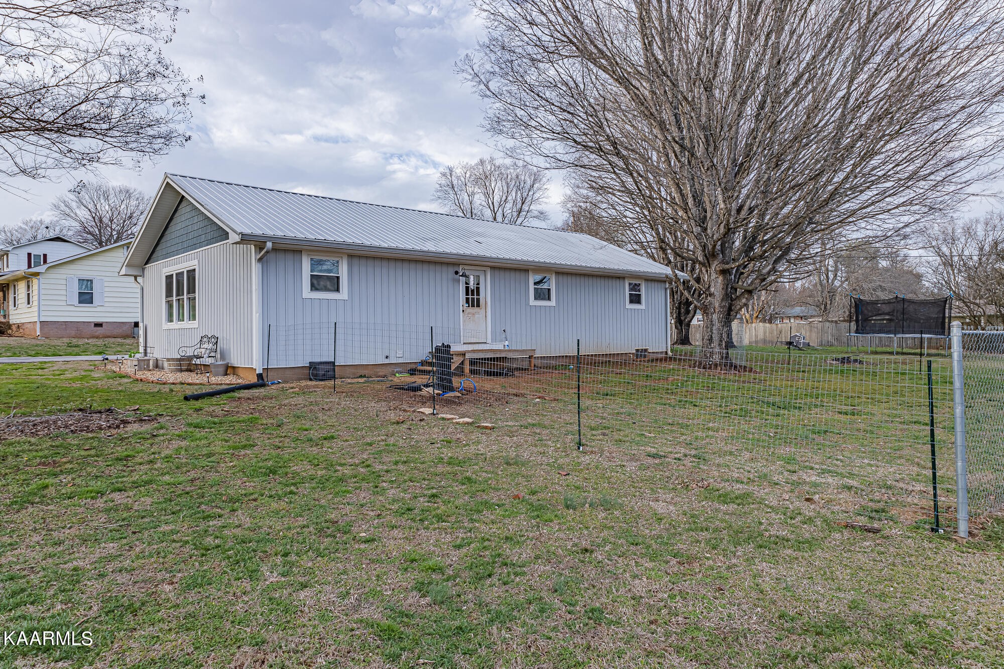 112 County Road 142 Riceville, TN 37370 - Photo 6 of 28 a house view with a garden space