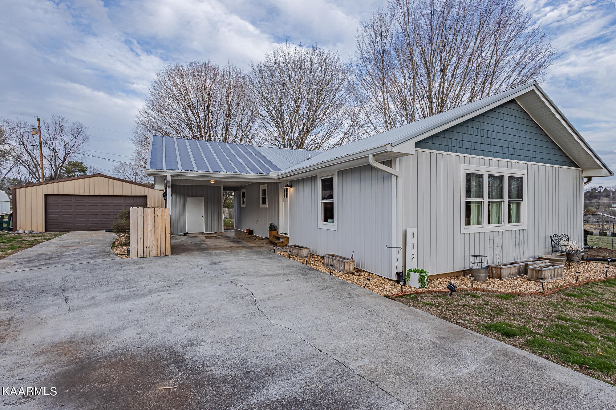 112 County Road 142 Riceville, TN 37370 - Photo 7 of 28 a view of a house with a patio and a yard