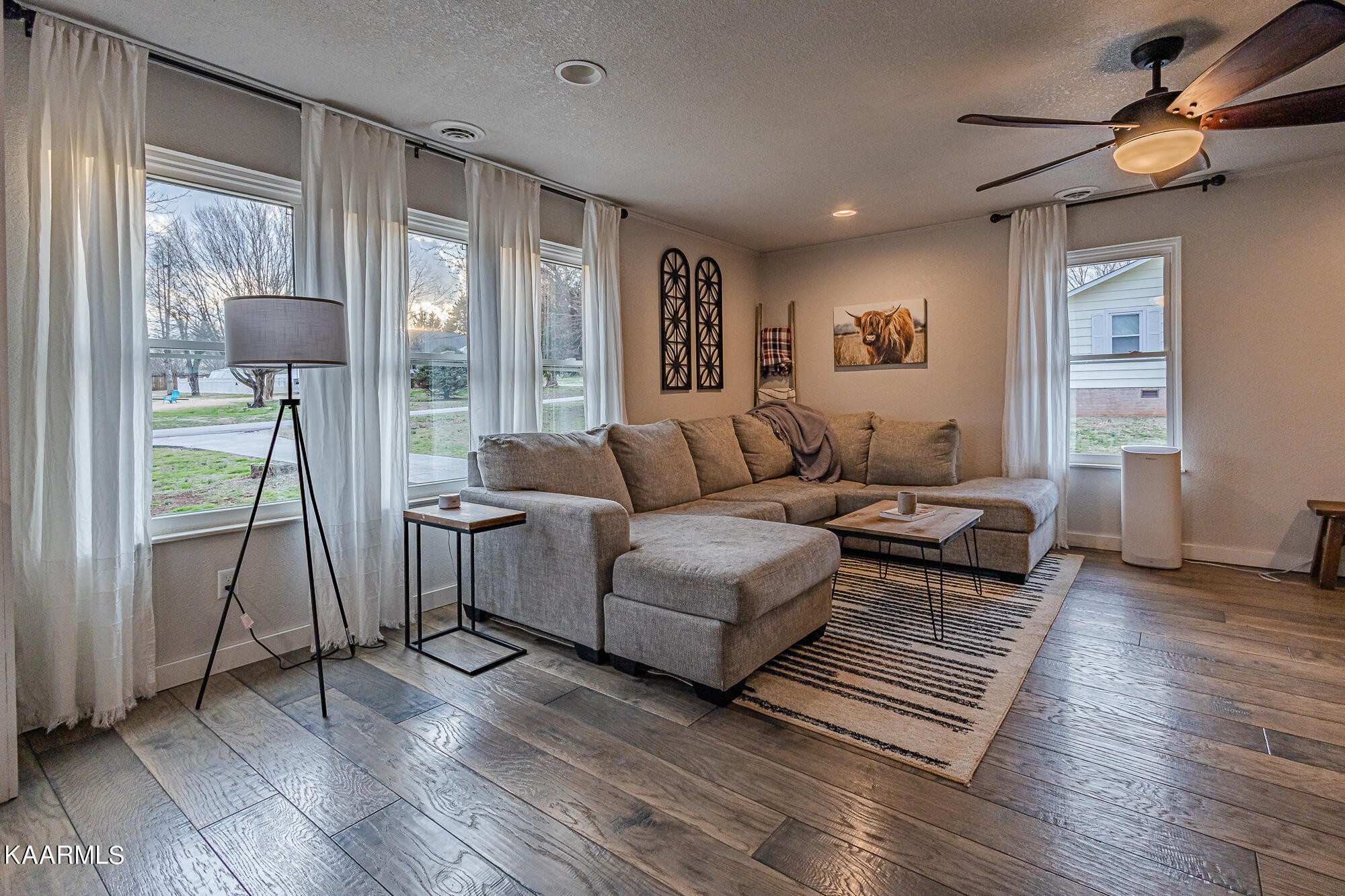 112 County Road 142 Riceville, TN 37370 - Photo 9 of 28 a living room with furniture and a floor to ceiling window