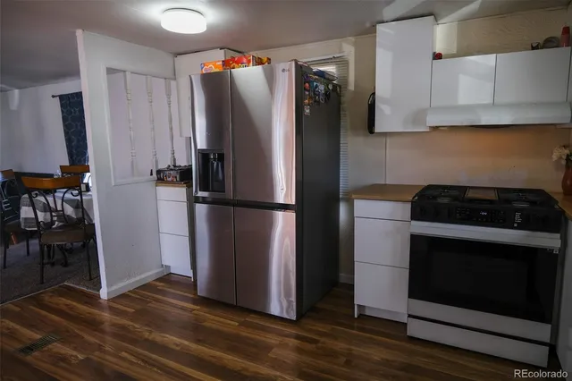 a kitchen with appliances and cabinets