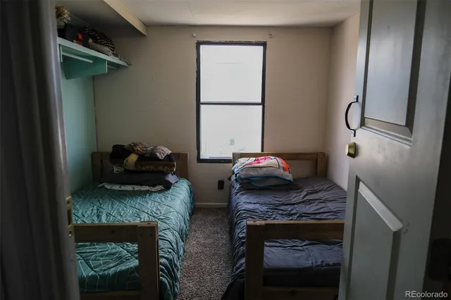 a kitchen with stainless steel appliances granite countertop a sink dishwasher a stove and a refrigerator with cabinets