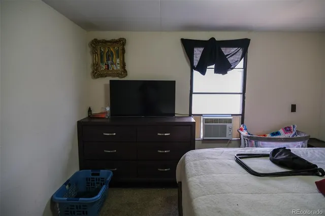a bedroom with a bed and a cabinets