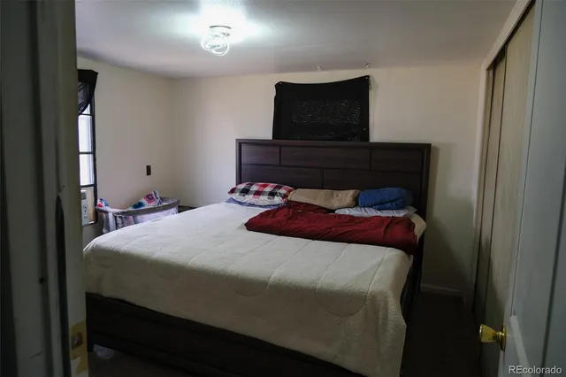 a bathroom with a toilet sink and shower