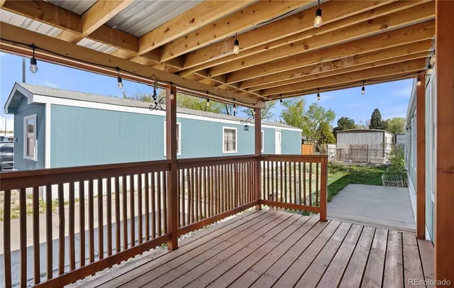 a view of a porch with wooden floor