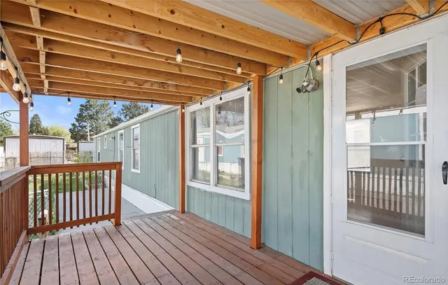 a view of porch with deck and wooden floor