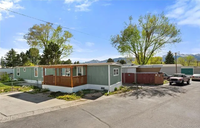 a view of a car park in front of a house