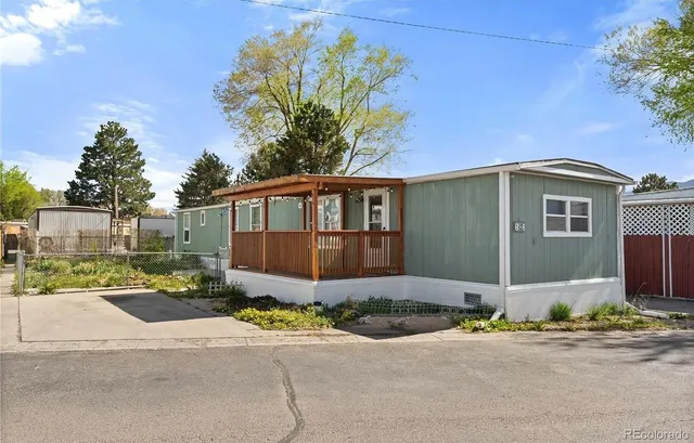a front view of a house with a yard and a garage