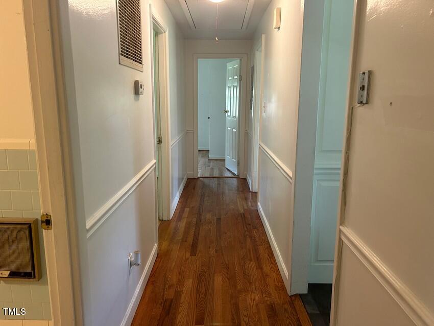 111 Colonial Drive Clinton, NC 28328 - Photo 17 of 21 a view of a hallway with wooden floor and staircase
