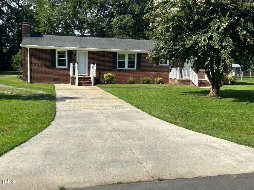 111 Colonial Drive Clinton, NC 28328 - Photo 2 of 21 front view of house with a yard