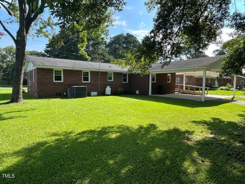 111 Colonial Drive Clinton, NC 28328 - Photo 3 of 21 a view of a house with a yard porch and sitting area