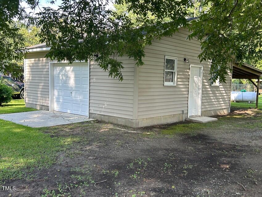 111 Colonial Drive Clinton, NC 28328 - Photo 4 of 21 a view of a house with backyard and a tree