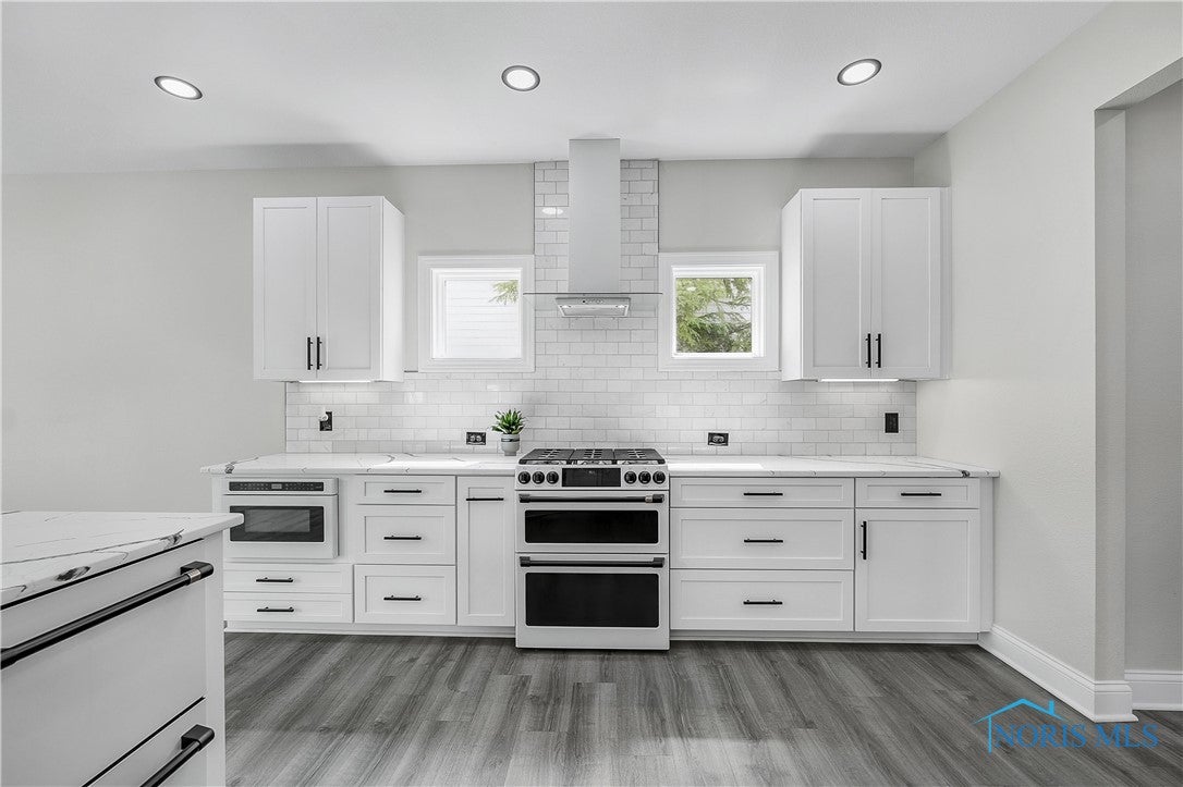 9414 Sheffield Road Perrysburg, OH 43551 - Photo 13 of 34 A designer kitchen, so sleek and light.