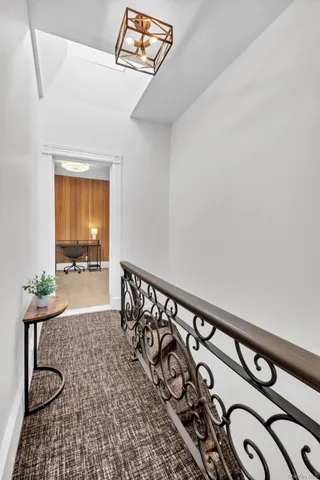 a view of a hallway with windows