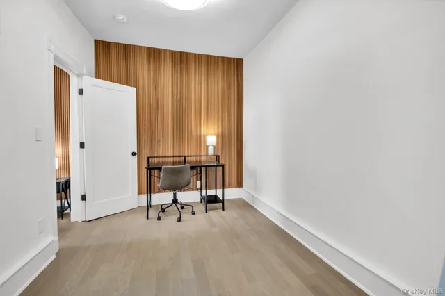 a view of room with a table and chairs