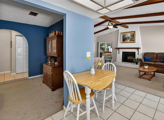 a dining room with furniture and window