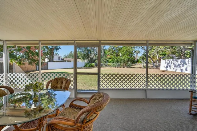an aerial view of residential house with outdoor space and swimming pool