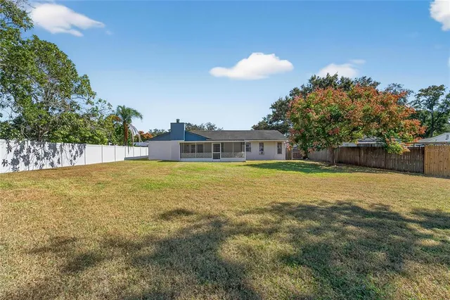 an aerial view of residential house and outdoor space