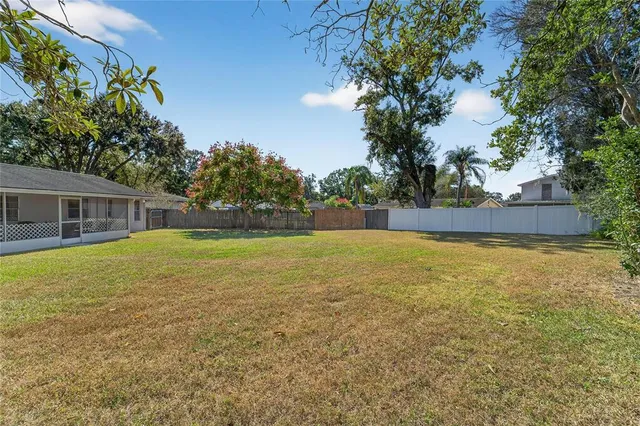 a view of house with outdoor space and sitting area