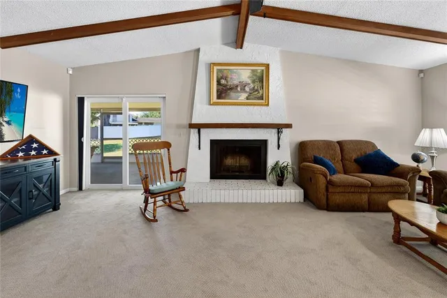 a view of a livingroom with furniture and a window